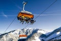 Skiers sitting onski lift chair in ski resort Jasna, Slovakia