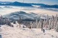 Skiers on ski lift on ski resort on Kubinska Hola during winter Royalty Free Stock Photo