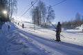 Skiers on a ski lift on a small ski slope on the outskirts of Moscow