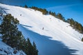 Skiers skiing fast on steep piste in Pyrenees Mountains., Andorra Royalty Free Stock Photo