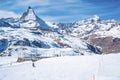 Skiers skiing on white landscape against Matterhorn mountain during winter Royalty Free Stock Photo