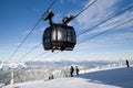 Skiers on the slope. Cableway Funitel in Low Tatras mountains, S