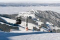 Skiers on the slope. Cableway Funitel in Low Tatras mountains, S