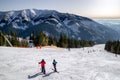 Skiers on slope and surface lift n resort Chopok Juh at Low Tatras mountains, Slovakia