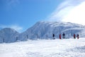 Skiers on slope and view on Chopok peak