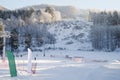 Skiers and snouborders on snow slope in winter ski resort. Ski elevator on snow mountain. Winter activity concept. Cable car ski Royalty Free Stock Photo