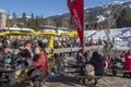 Skiers and snow boarders enjoying apres ski at Whistler ski resort, BC