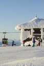 Skiers at snow covered lift terminal Royalty Free Stock Photo