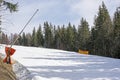 skiers on a snow slope for beginners on a sunny day.