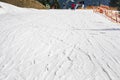 skiers on a snow slope for beginners on a sunny day.