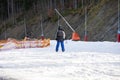 skiers on a snow slope for beginners on a sunny day.