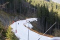 skiers on a snow slope for beginners on a sunny day.