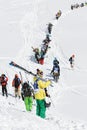 Skiers and snowboarders climb the mountain for freeride