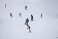 Skiers and snowboarders going down the slope. Royalty Free Stock Photo