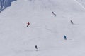 Skiers and snowboarders going down the slope Royalty Free Stock Photo