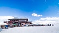 Skiers, snowboarders relaxing near mountain hut, Alps, Livigno, Italy Royalty Free Stock Photo