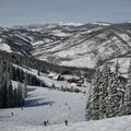 Skiers and snowboarders riding down the slope at the Vail Ski Resort, Colorado. Royalty Free Stock Photo