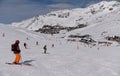 Skiers and snowboarders riding down the slope at the Val Thorens Ski resort in France. Royalty Free Stock Photo