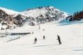 Skiers and snowboarders riding on a ski slope mountain resort