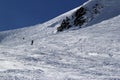 Skiers and snowboarders riding on a ski slope in mountain resort snowy winter, ski resort Rosa Khutor Royalty Free Stock Photo