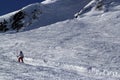 Skiers and snowboarders riding on a ski slope in mountain resort snowy winter, ski resort Rosa Khutor Royalty Free Stock Photo