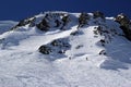 Skiers and snowboarders riding on a ski slope in mountain resort snowy winter, ski resort Rosa Khutor Royalty Free Stock Photo