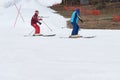 Skiers and snowboarders riding on a ski slope Royalty Free Stock Photo