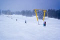 Skiers and snowboarders on a ski lift Royalty Free Stock Photo