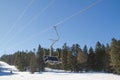 Skiers and snowboarders on a ski lift Royalty Free Stock Photo
