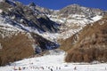 Skiers on snowy slope Felskinn snow sports routes with natural snow. Royalty Free Stock Photo