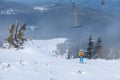 Skiers on T-bar ski lift in Szklarska Poreba, Poland