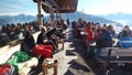 Skiers take a break on a cafe terrace in the mountais. Austria.