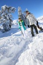 Skiers walking in the snow Royalty Free Stock Photo