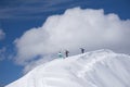 Skiers walking uphill for freeride