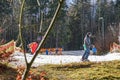 Skiers on wide ski slope on sunny day. Blue sky