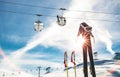 Skiing goggles and skis poles at resort glacier with chair lift