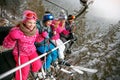 Skiing, ski lift, ski resort - happy family skiers on ski lift Royalty Free Stock Photo