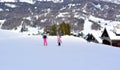 Skiing and sledding in the snow on a beautiful sunny day Royalty Free Stock Photo