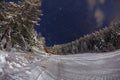 Skiing slope at night below starry sky Royalty Free Stock Photo