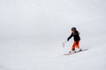 Skiing in the snow. One Asian child skier on the ski slope. Vacation in Switzerland Royalty Free Stock Photo