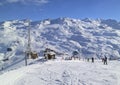 Skiing snowboarding slopes in snowy winter Alps mountains