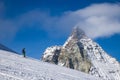 skiing under Matterhorn peak against blue sky Swiss Alps