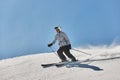 Skiing in the winter snowy slopes Royalty Free Stock Photo