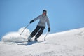 Skiing in the winter snowy slopes Royalty Free Stock Photo