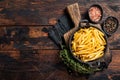 Skilet full of Potato french fries with salt. Wooden background. Top view. Copy space Royalty Free Stock Photo