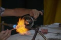 Skilful hands shaping hot and dangerous glass