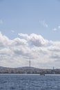 skiline of the city of Istanbul, with the Camlica communications tower and a sailboat sailing over the Bosphorus, copy space