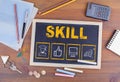 Skill Business concept. Chalkboard on wooden office desk Royalty Free Stock Photo