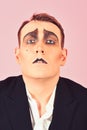 Skill at improvisation. Mime artist. Mime with face paint. Man with mime makeup. Theatre actor miming. Stage actor