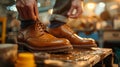 Skilled artisan meticulously applying a finish to handcrafted leather shoes in a workshop Royalty Free Stock Photo